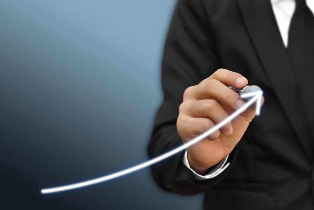 25rc6 businessman drawing arrow on screen graph corporate